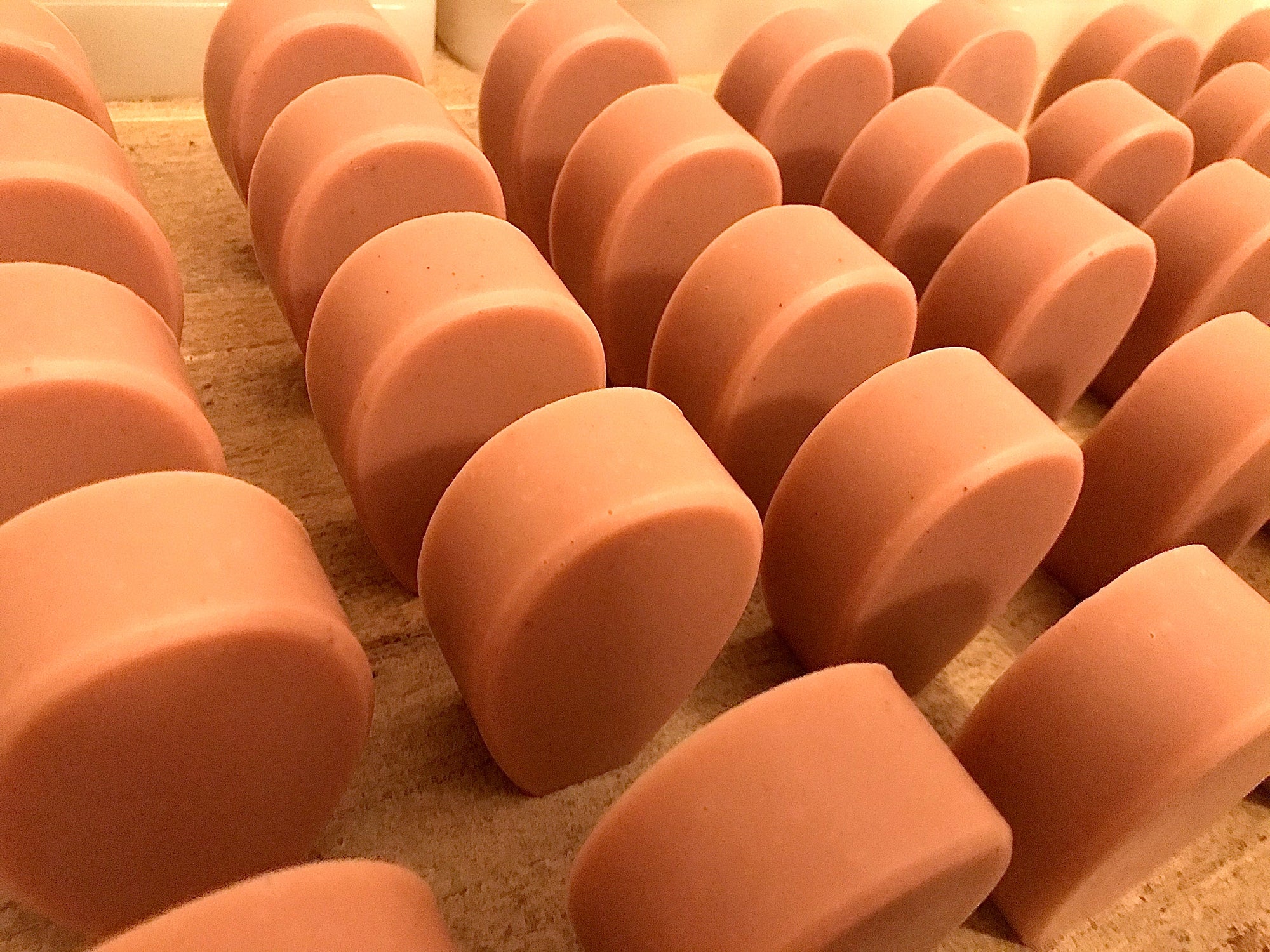 Rows of Nopalera soap bars lined up in production.