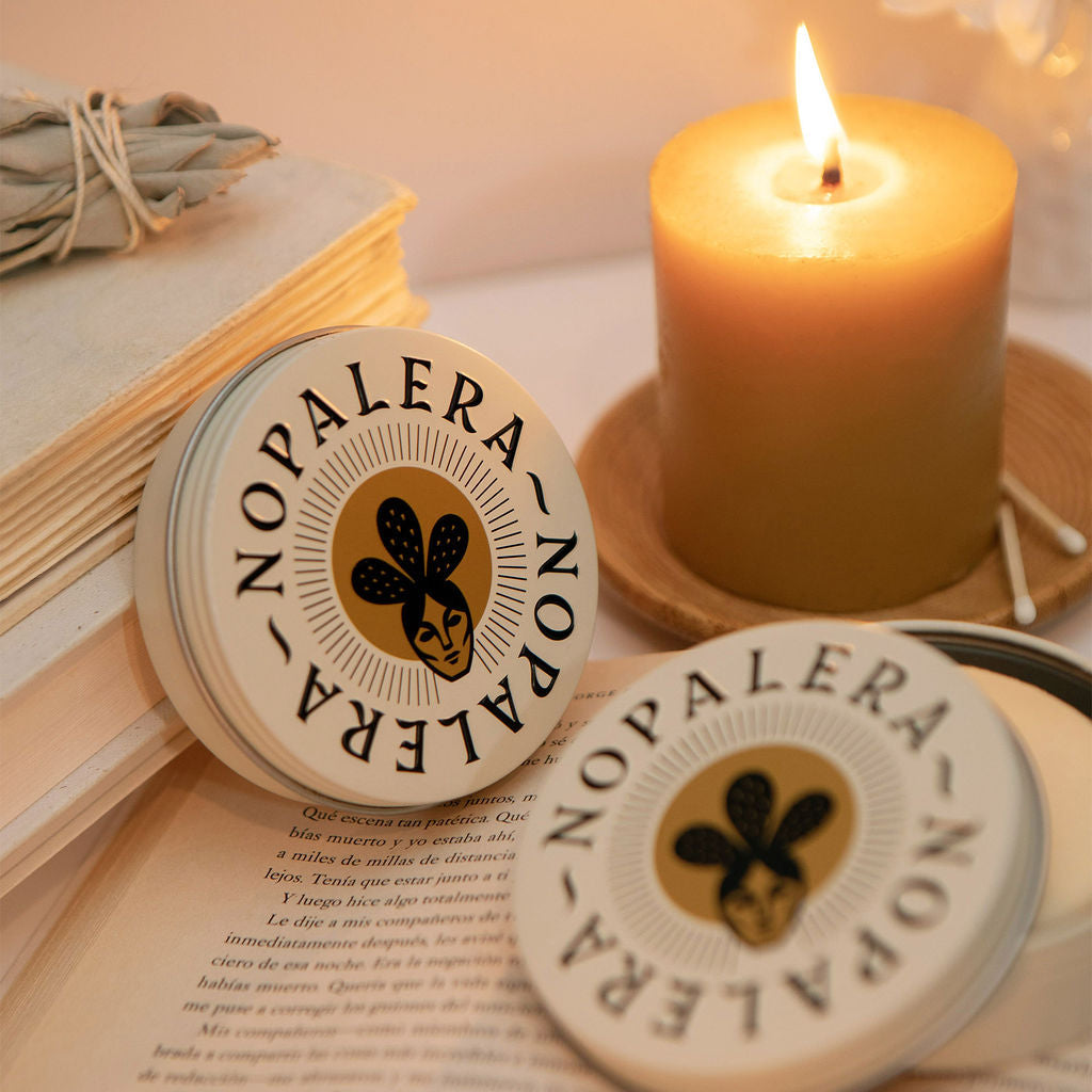 Nopalera Citrus Lotion Bar styled beside a lit candle and books in a cozy self-care setting.