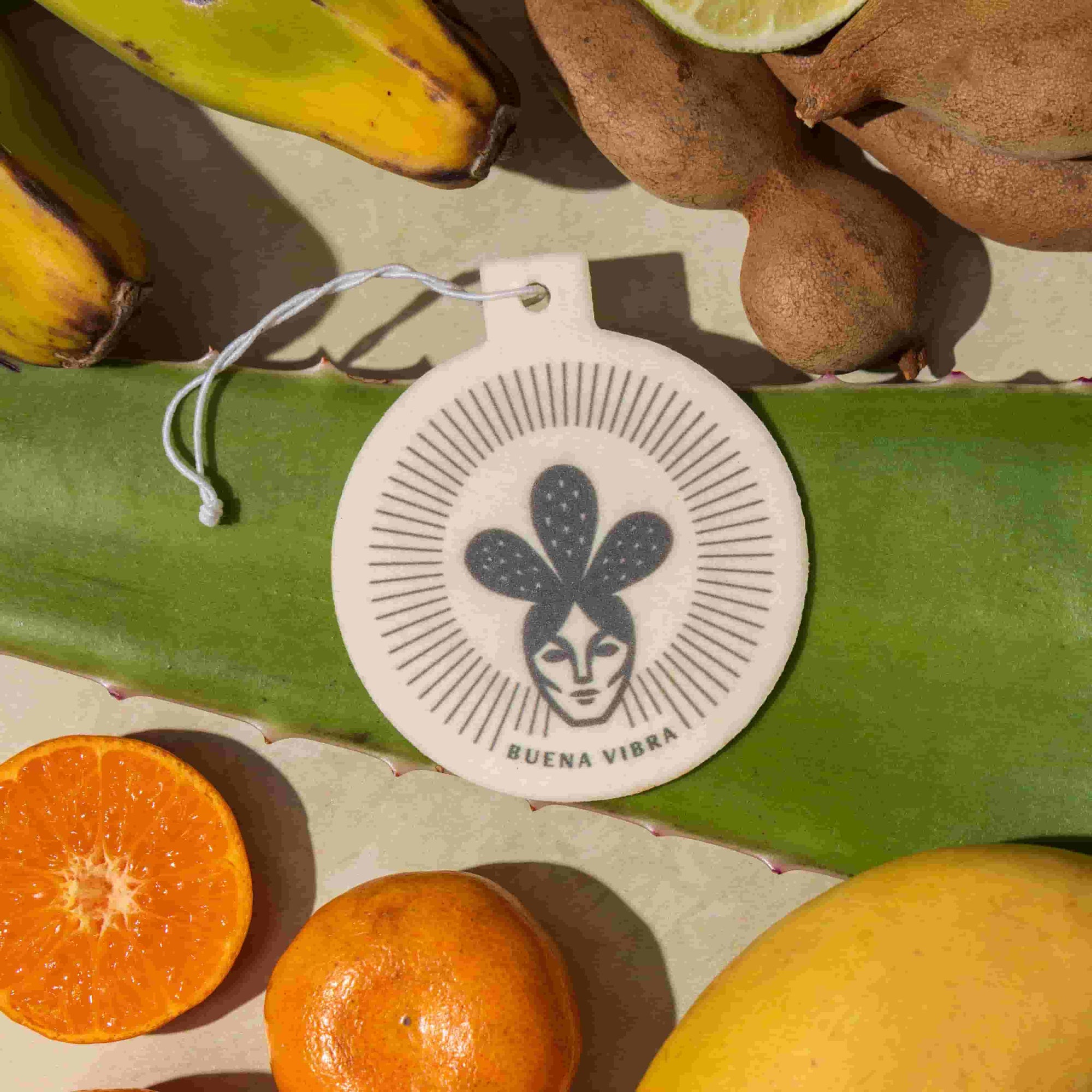 Buena Vibra car freshener with tropical fruits and aloe leaf