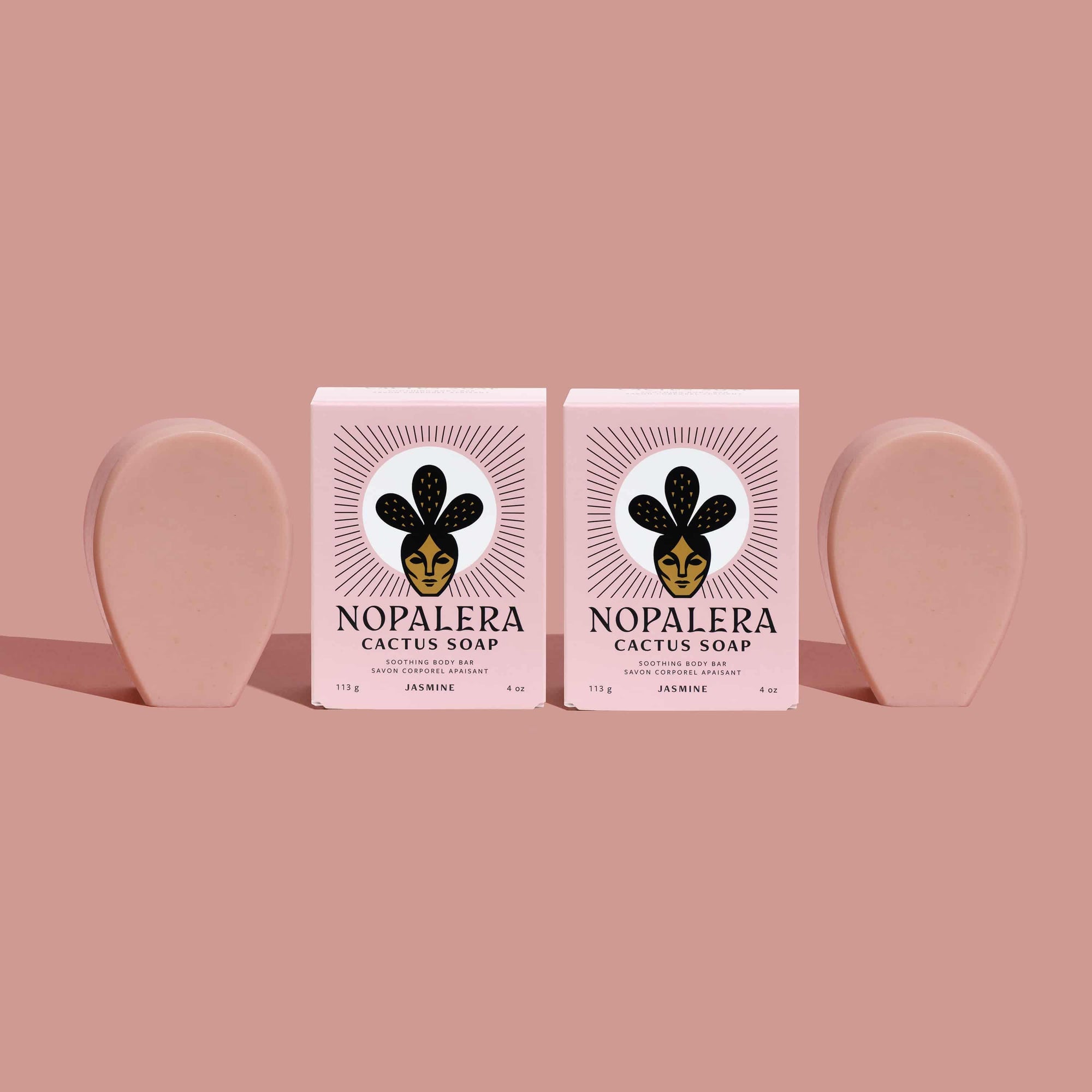 Two Nopalera cactus soap bars on a pink background
