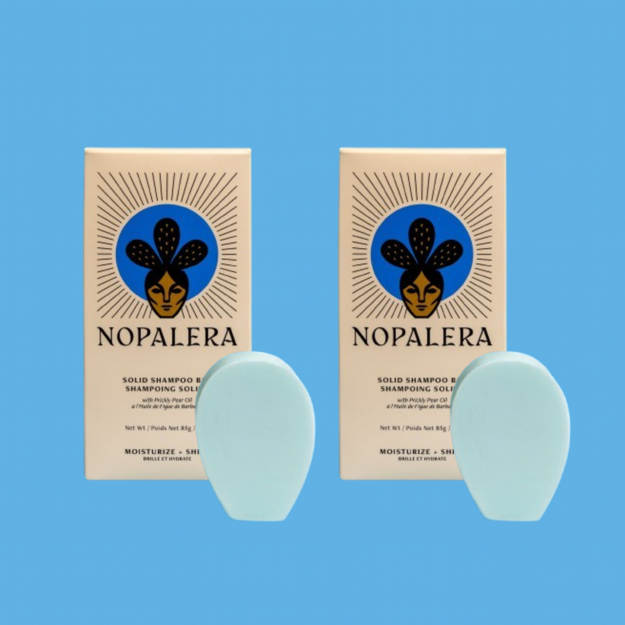 Two Nopalera solid shampoo bars with matching packaging against a blue background.