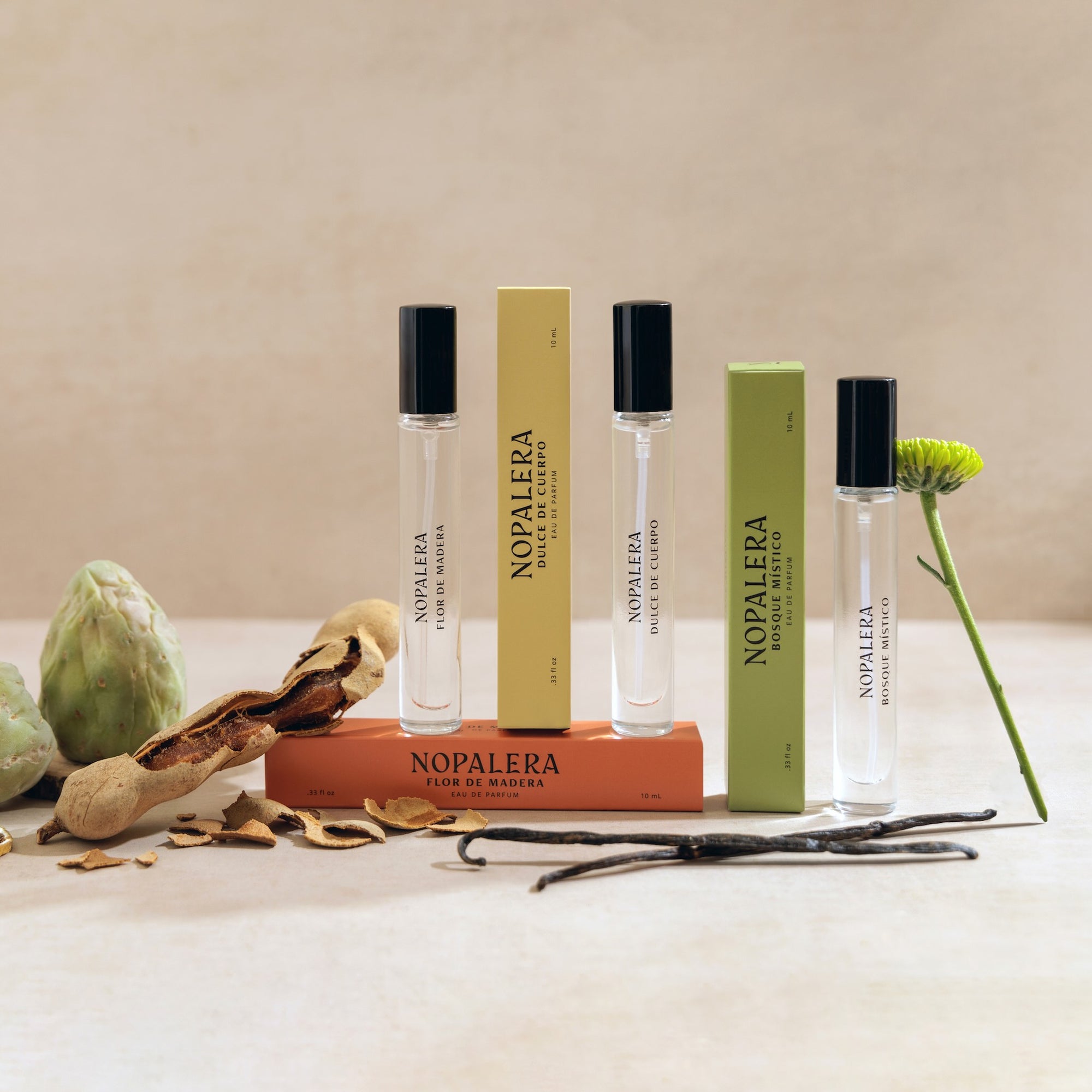 Nopalera perfume travel bottles and packaging on a neutral background with natural elements.