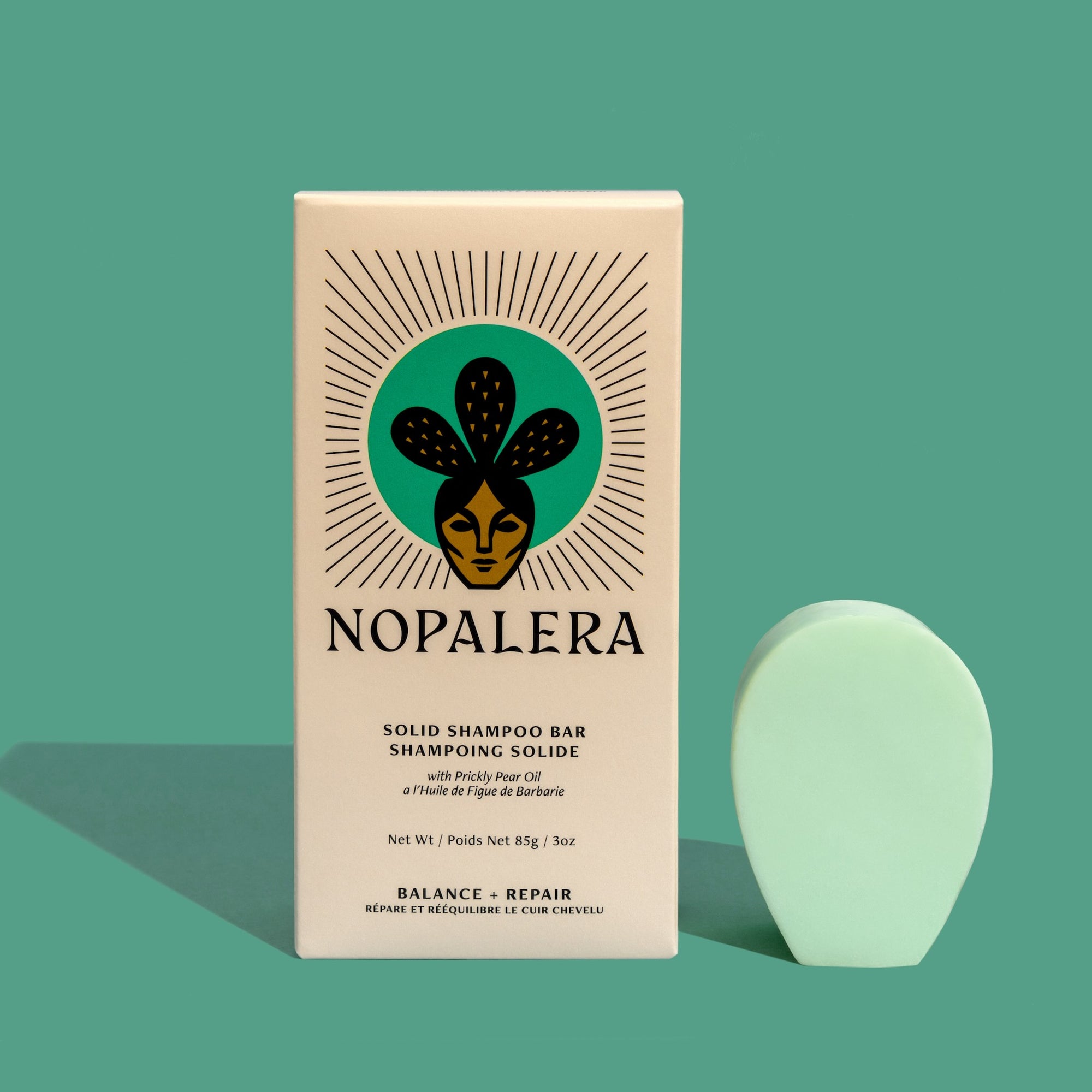 Nopalera shampoo bar next to its packaging, which is labeled 'Nopalera Solid Shampoo Bar Balance + Repair.