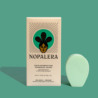 Nopalera shampoo bar next to its packaging, which is labeled 'Nopalera Solid Shampoo Bar Balance + Repair.