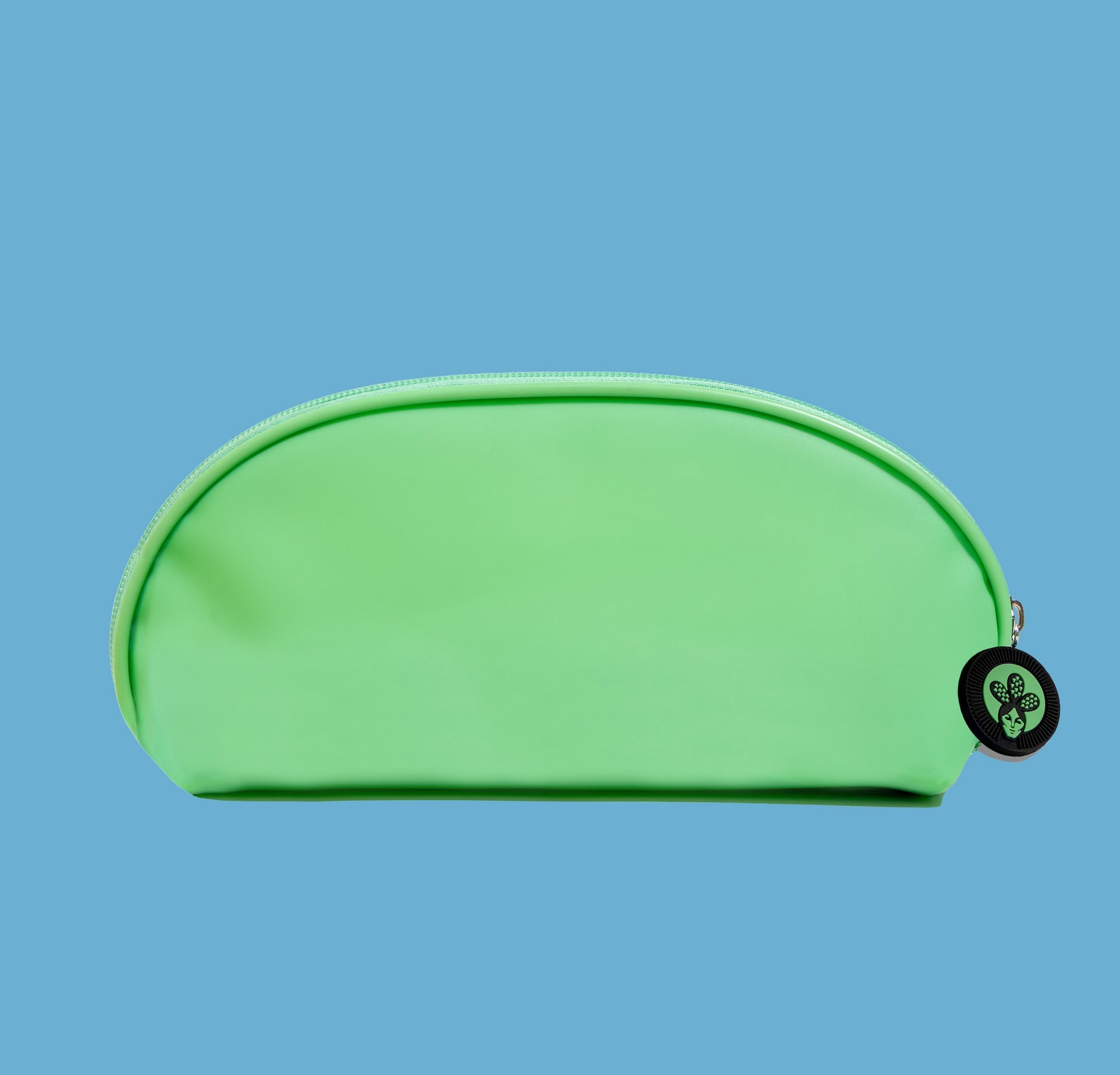 Nopalera green jelly bag with a tag showing a leaf, possibly indicating a hair care product.