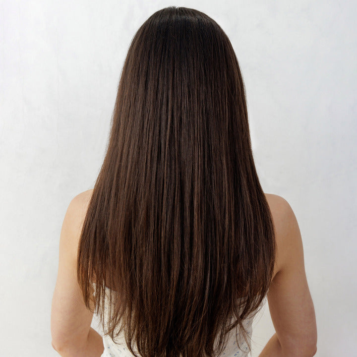 Person with long, straight brown hair on a white background Nopalera