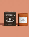 Nopalera Ibarra scented candle and packaging on a brown background