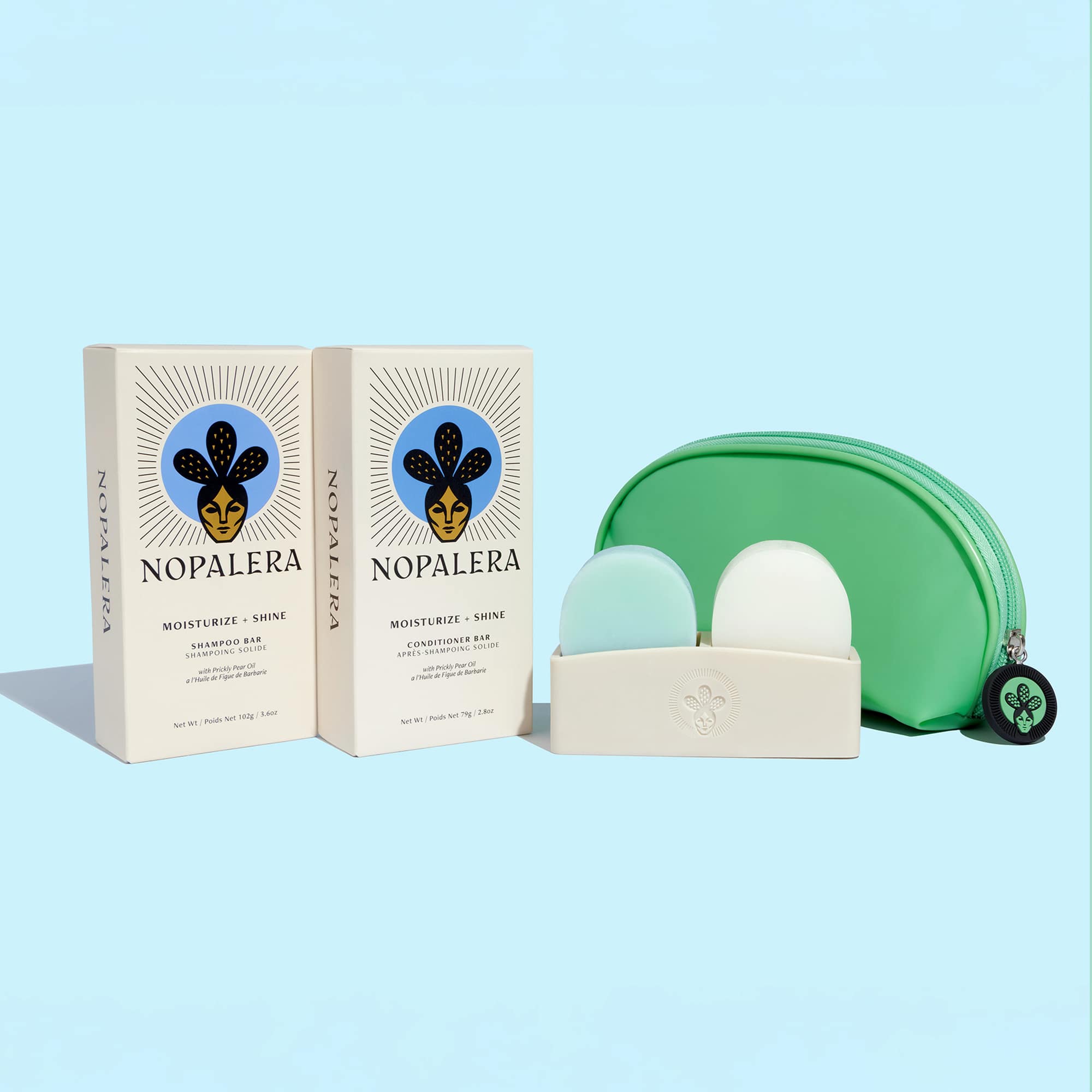 Nopalera shampoo and conditioner bars with storage pouch and soap dish on a light blue background