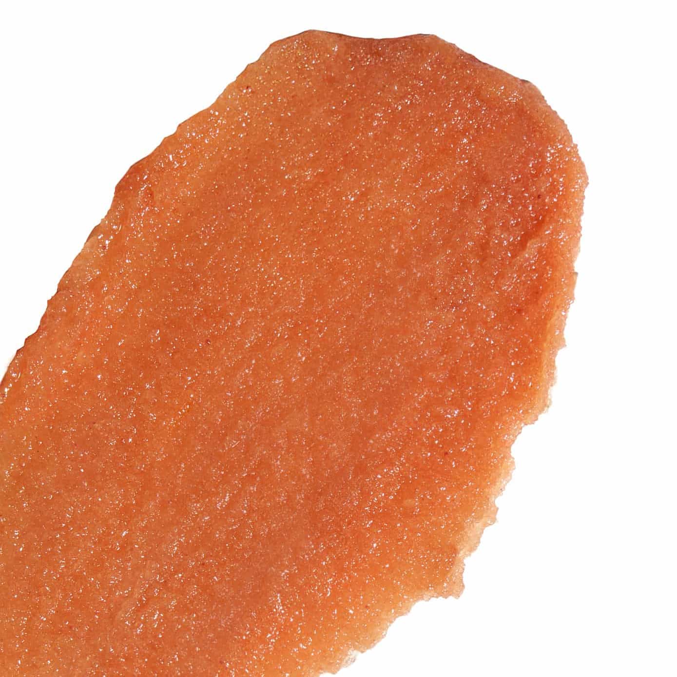 Close-up of a piece of Flor de Madera Body Polish on a white background