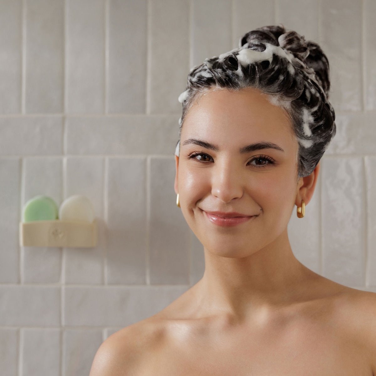 Hair model showing healthy hair results from using Nopalera Balance and Repair shampoo bar