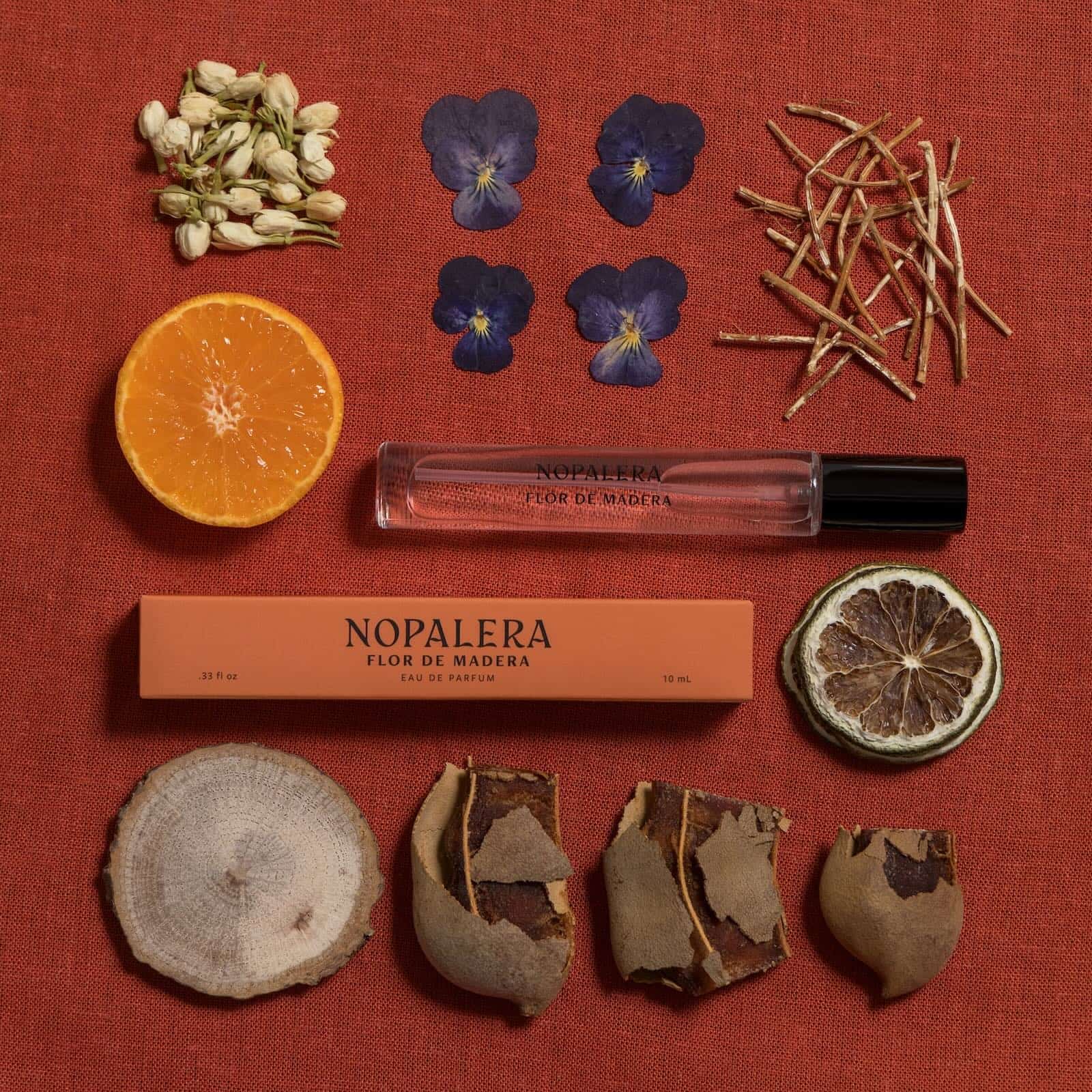 Nopalera Flor de Madera 10ml travel perfume roller with citrus, flowers, and woody fragrance ingredients.