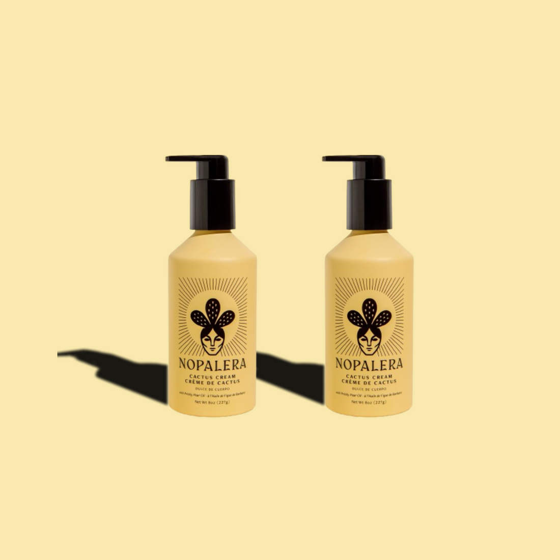 Two Nopalera cactus cream bottles displayed against a soft yellow background.