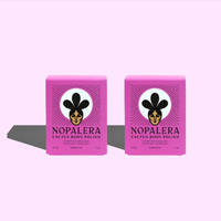 Two pink boxes of Nopalera Cactus Body Polish on a light purple background