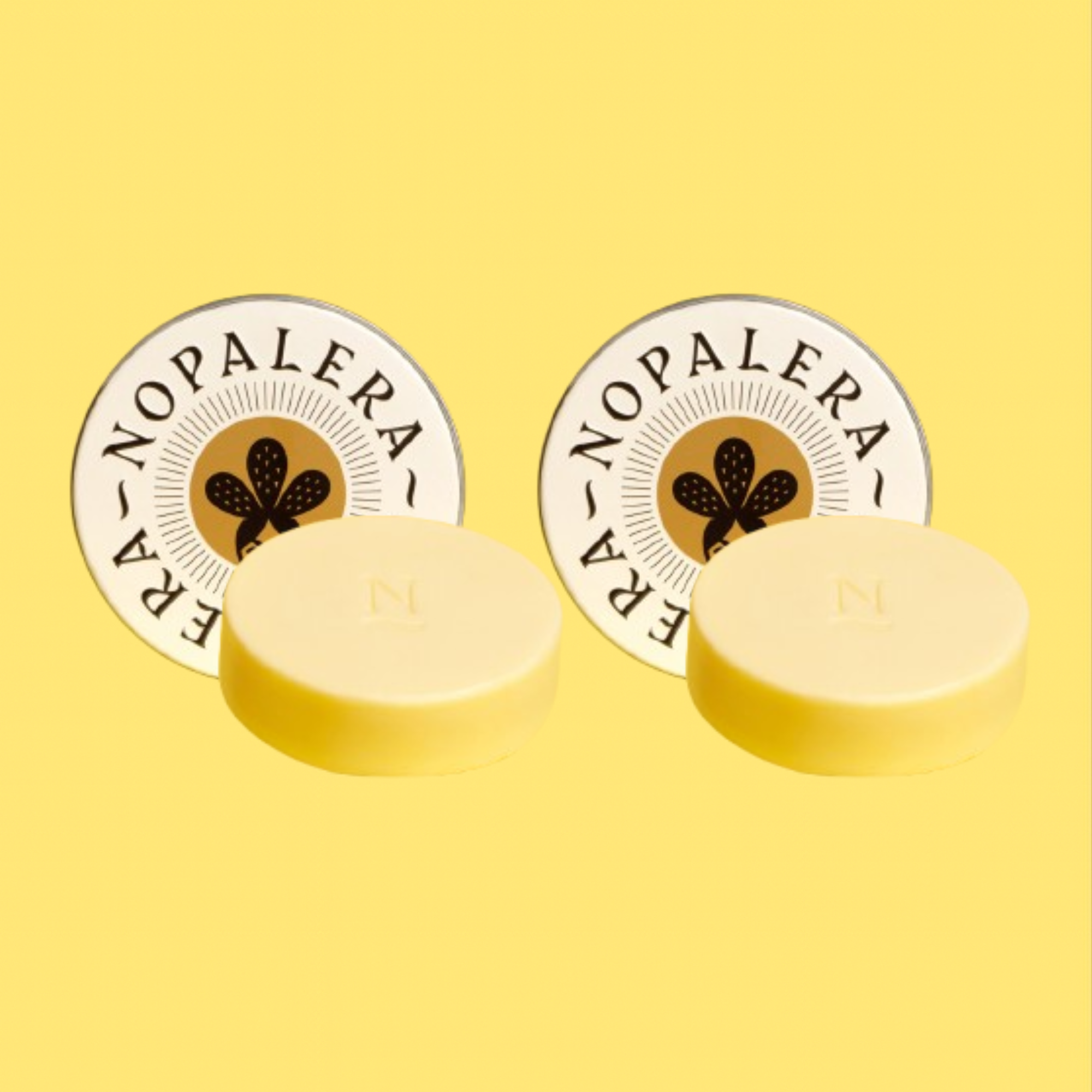 Two yellow citrus lotion bar with 'Nopalera' branding on a yellow background