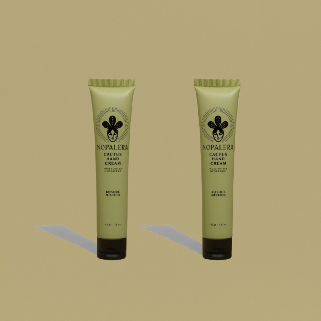 Two tubes of Nopalera Bosque Místico Hand Cream on a green background