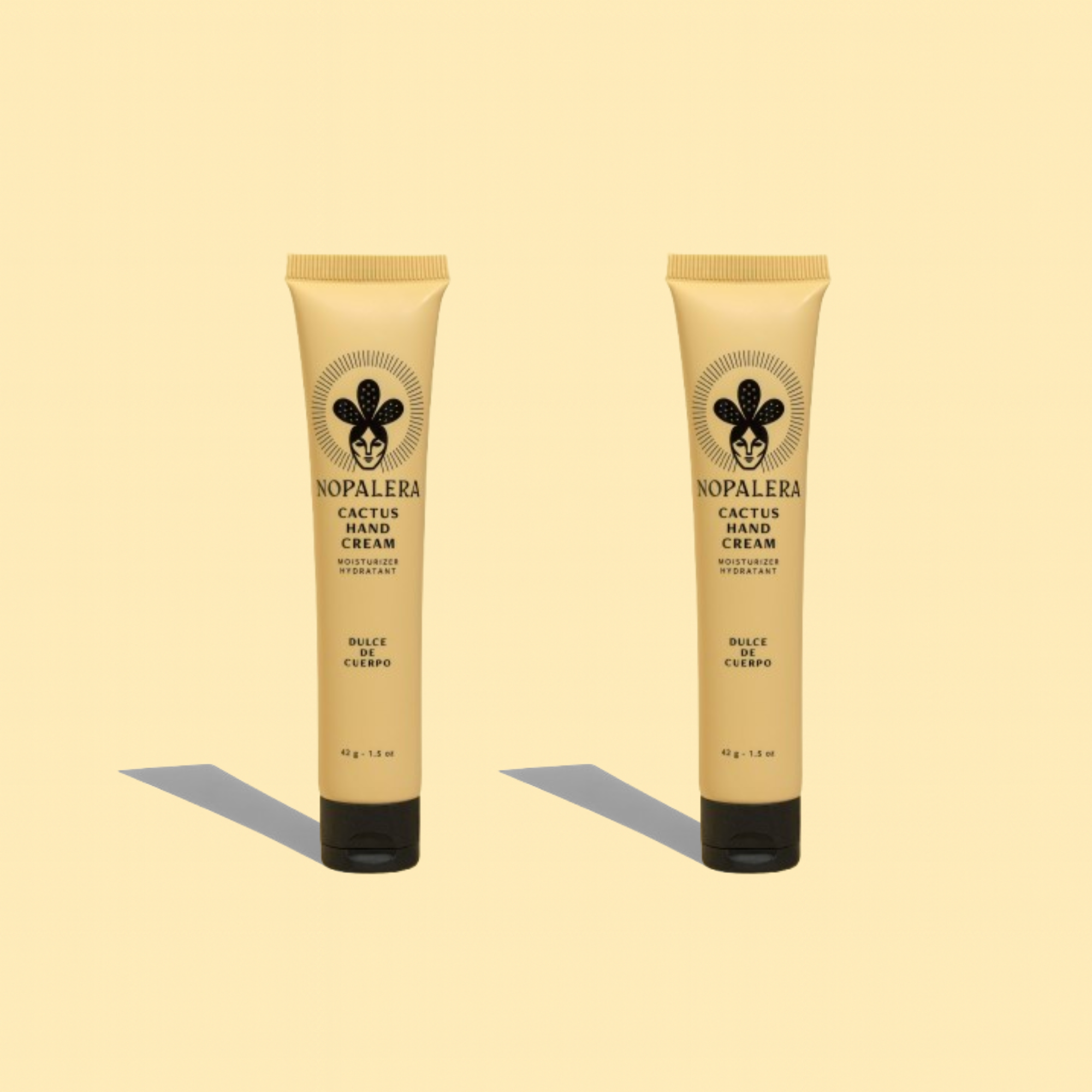 Two Nopalera cactus hand cream tubes in Dulce de Cuerpo scent displayed against a beige background