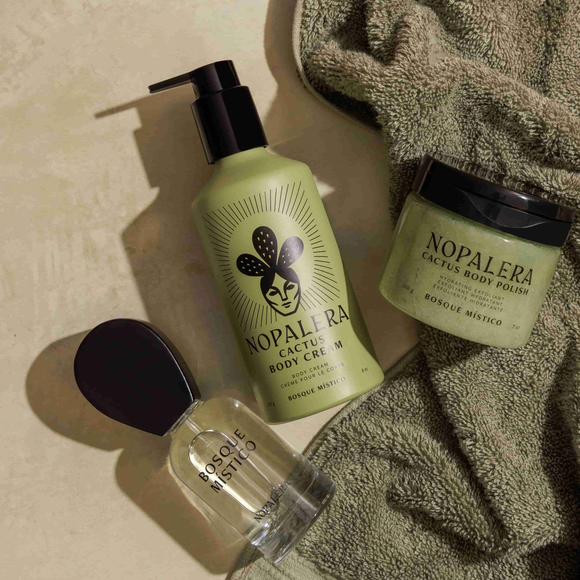 Nopalera cactus body care products on a green surface with a green towel.