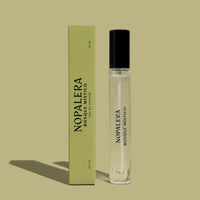 A 10mL Luxury Mexican travel spray bottle  perfume - Bosque Místico with a clear liquid visible inside, labeled 'Nopalera Bosque Místico'. The product is accompanied by a green box with the same labeling.